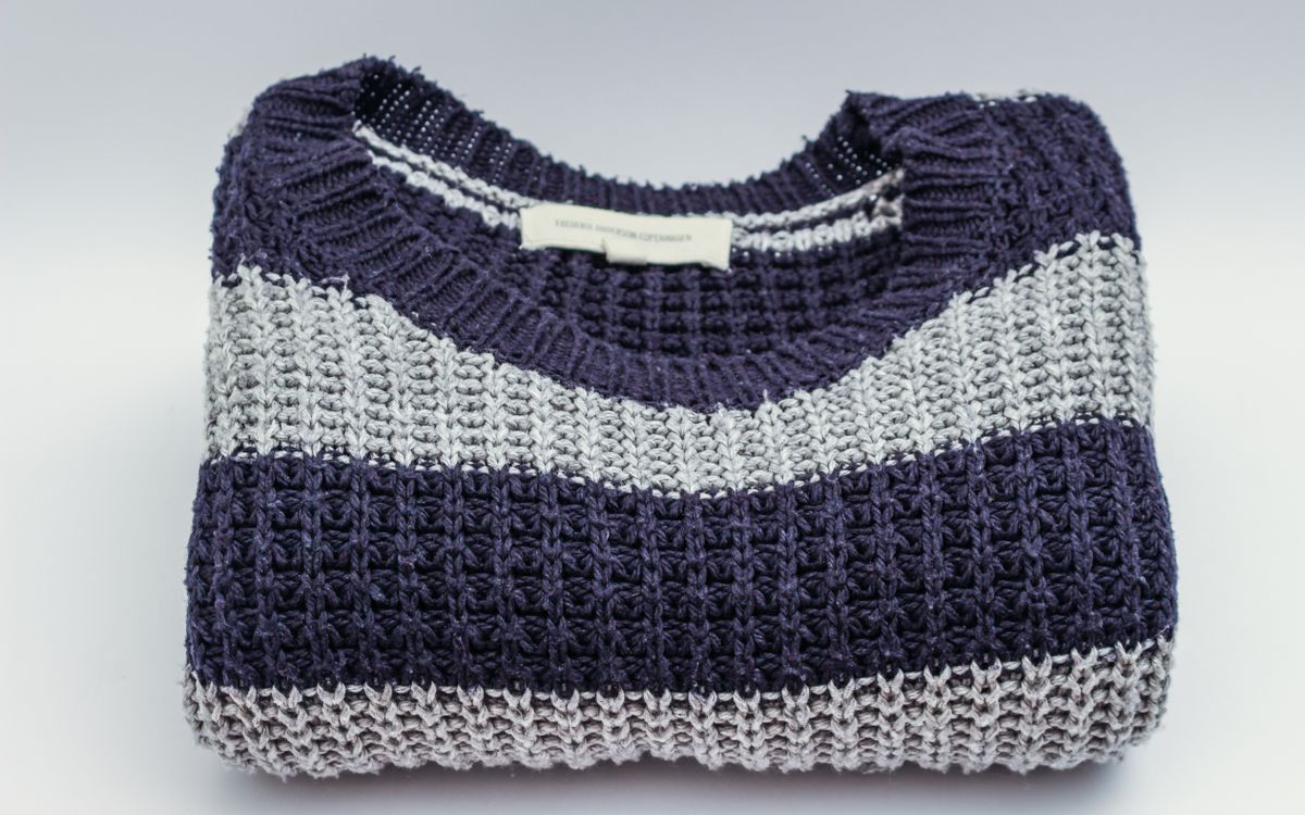 A gray and black striped crew-neck top