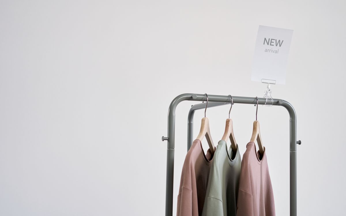 Newly arrived shirts on a clothing rack