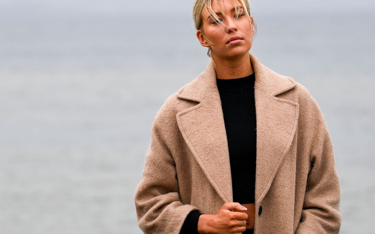 An elegant fashion portrait at a misty seaside